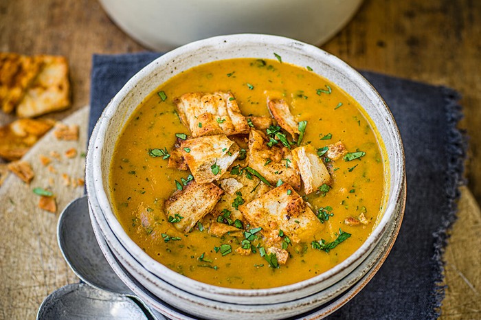 Carrot and coriander soup with spicy flatbread croutons