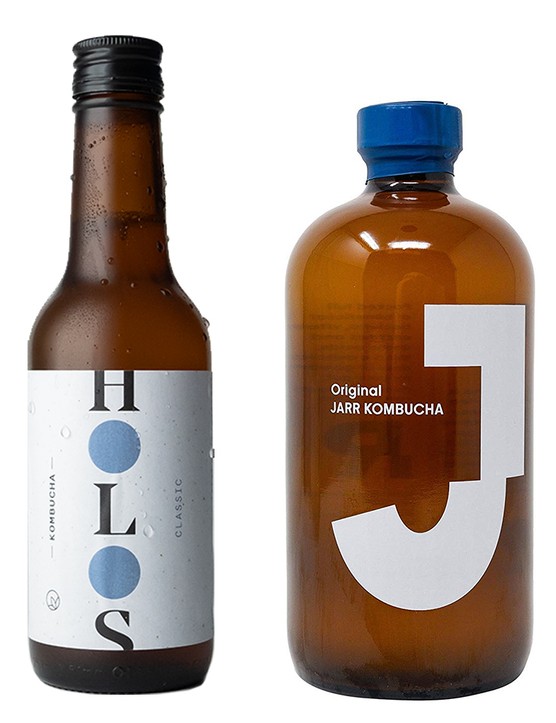 A line up of kombucha bottles