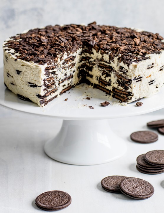 Oreo Baileys fridge cake, with a large chunk taken out to reveal the layered filling